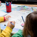 children using a map and drawing