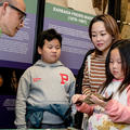 Children and researcher at museum